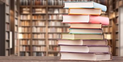 book,stack,on,the,desk,in,public,library