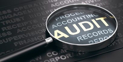 magnifying,glass,with,focus,on,the,word,audit,written,in