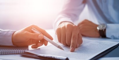 business,people,negotiating,a,contract.,human,hands,working,with,documents