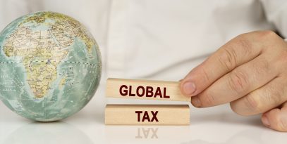 there,is,a,globe,on,a,white,reflective,surface,,in